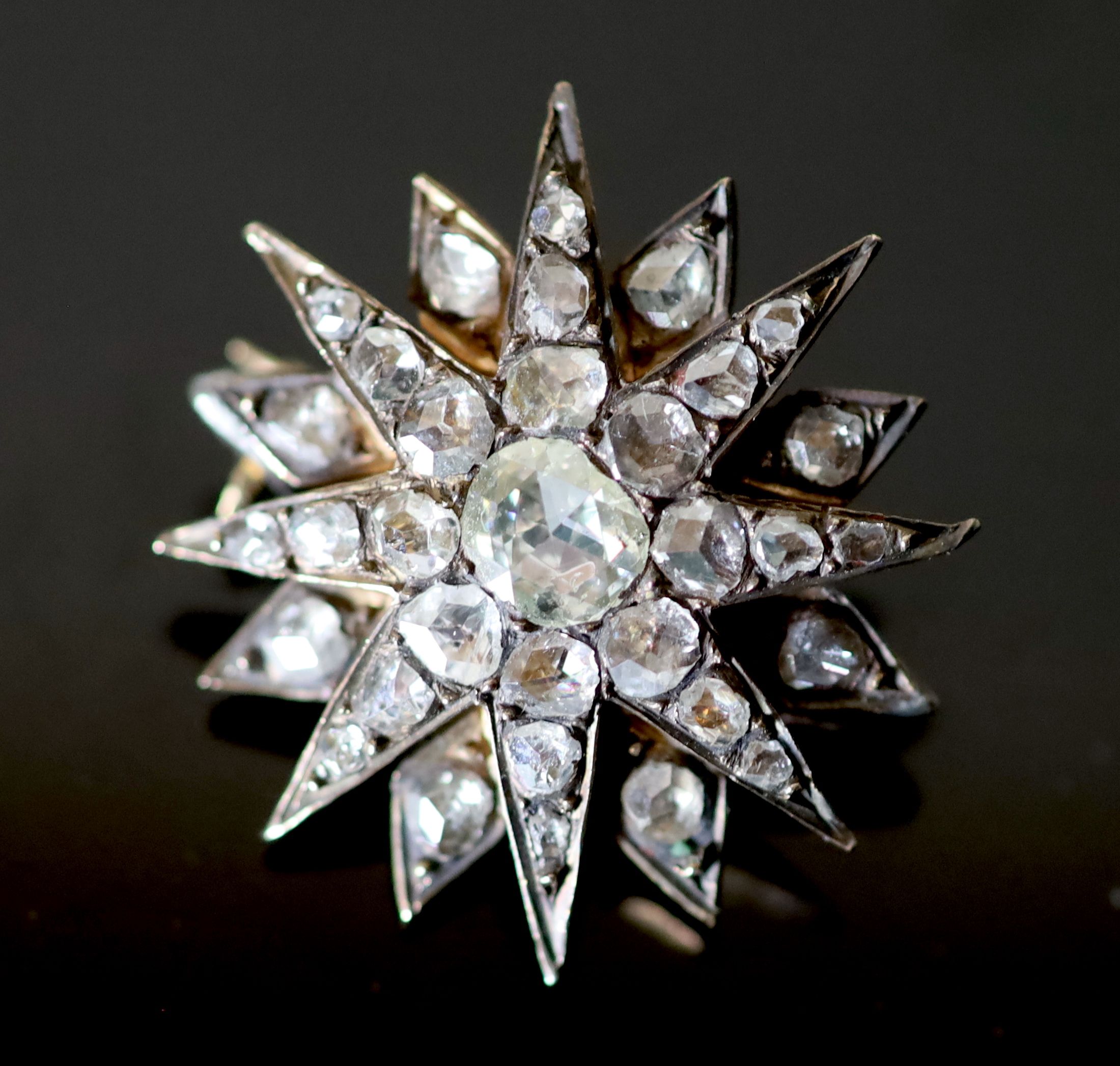 A 19th century French gold and foil backed rose cut diamond set starburst brooch,